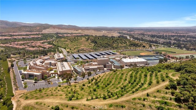 birds eye view of property featuring a mountain view