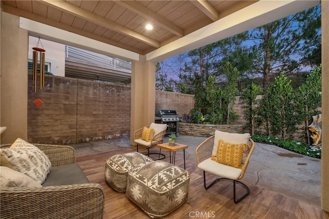 view of patio / terrace featuring area for grilling, a fenced backyard, and an outdoor living space