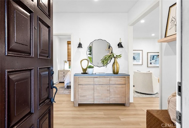 foyer featuring light wood-style floors and recessed lighting