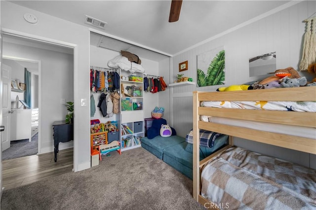 bedroom featuring carpet floors, visible vents, and ceiling fan