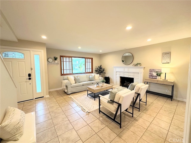 living area with a fireplace, light tile patterned floors, recessed lighting, and baseboards