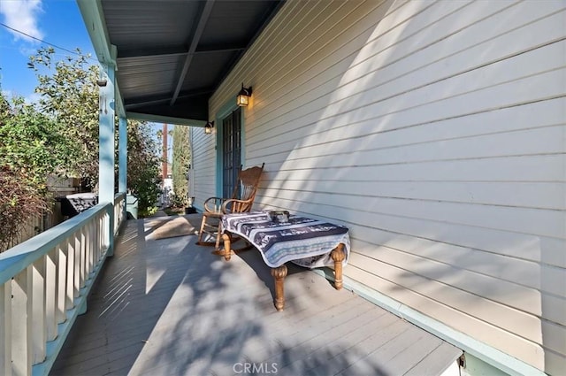 wooden terrace featuring a porch