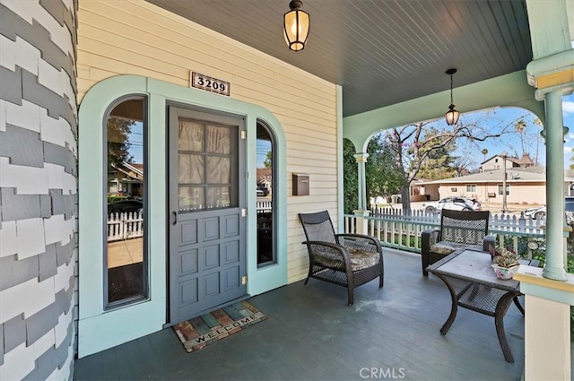 doorway to property featuring covered porch