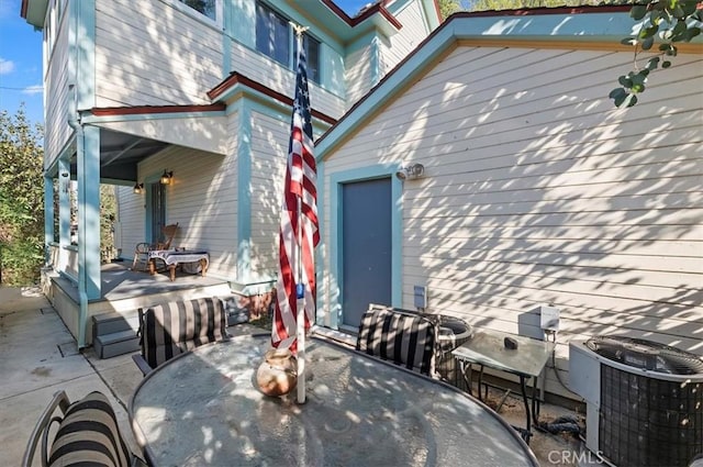 view of patio / terrace featuring outdoor dining area and central AC