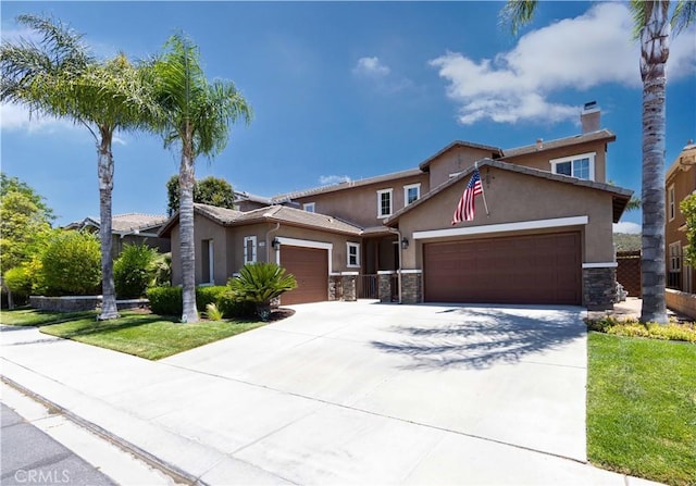 view of front of property with a garage, stone siding, driveway, and stucco siding