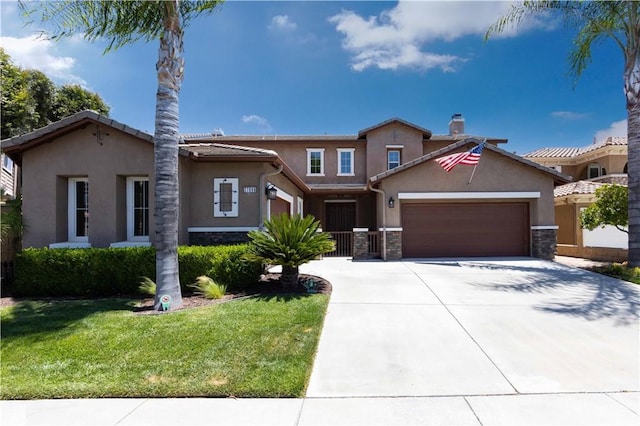 view of front of house with an attached garage, stone siding, a front lawn, and stucco siding