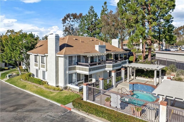 view of property featuring a community pool