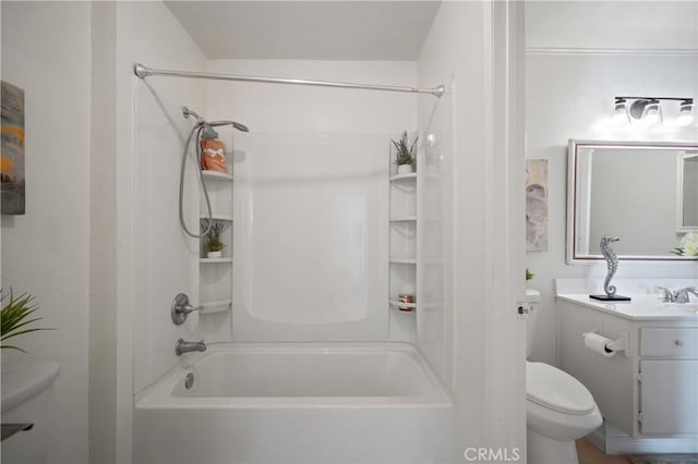 bathroom featuring bathtub / shower combination, vanity, and toilet