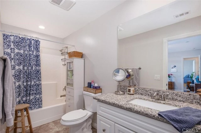 bathroom featuring toilet, shower / bath combo, vanity, and visible vents