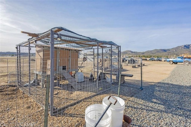 exterior space with an outdoor structure and a mountain view