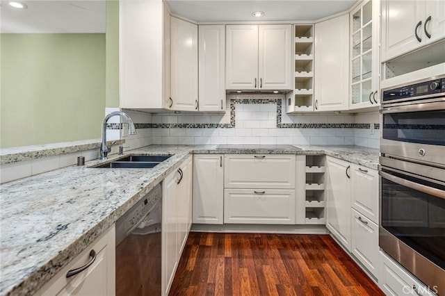 kitchen featuring dark wood-style flooring, open shelves, stainless steel appliances, white cabinetry, and a sink