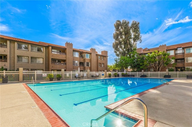 view of pool with fence