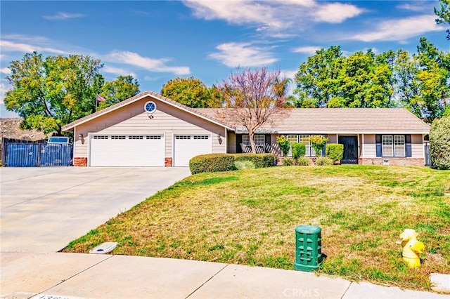 ranch-style home with a garage, concrete driveway, fence, a front lawn, and brick siding