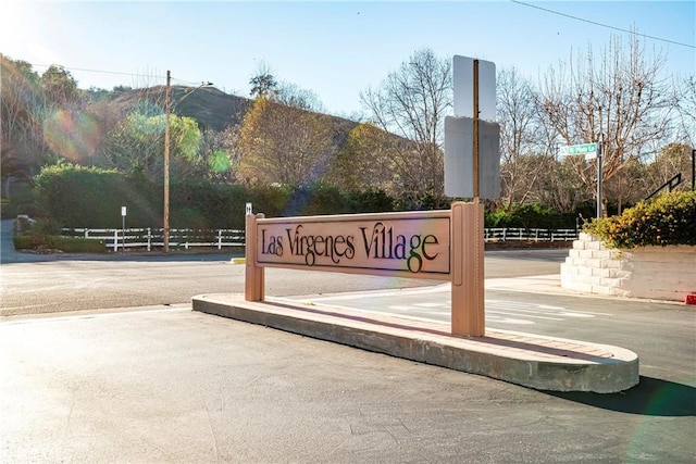 exterior space featuring a mountain view and fence