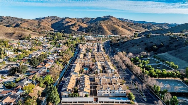 birds eye view of property with a mountain view