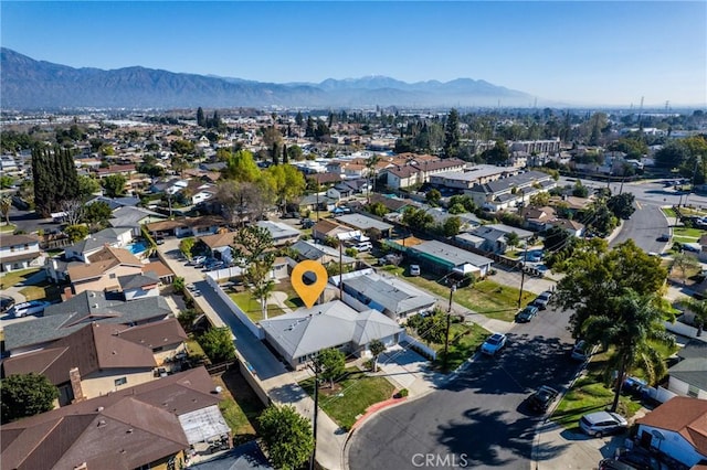 drone / aerial view featuring a residential view and a mountain view