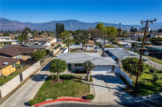 birds eye view of property with a residential view and a mountain view