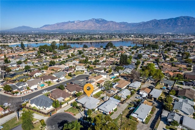 aerial view featuring a residential view and a water and mountain view