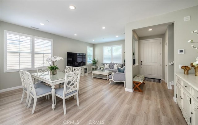 dining room with light wood-style floors, baseboards, visible vents, and recessed lighting