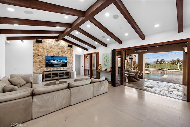 living room featuring recessed lighting and vaulted ceiling with beams