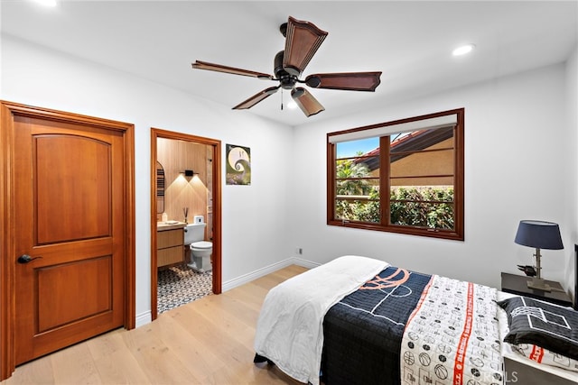 bedroom featuring recessed lighting, a ceiling fan, baseboards, light wood-style floors, and ensuite bath