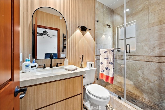 full bath with toilet, a shower stall, and vanity