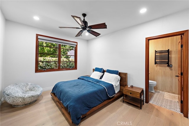 bedroom featuring a ceiling fan, wood finished floors, connected bathroom, and recessed lighting