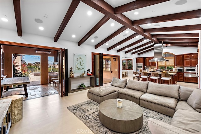 living area featuring vaulted ceiling with beams and recessed lighting