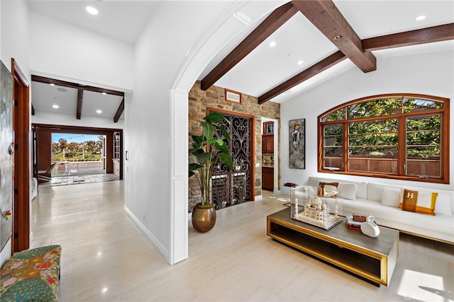 interior space with lofted ceiling with beams, baseboards, visible vents, and recessed lighting