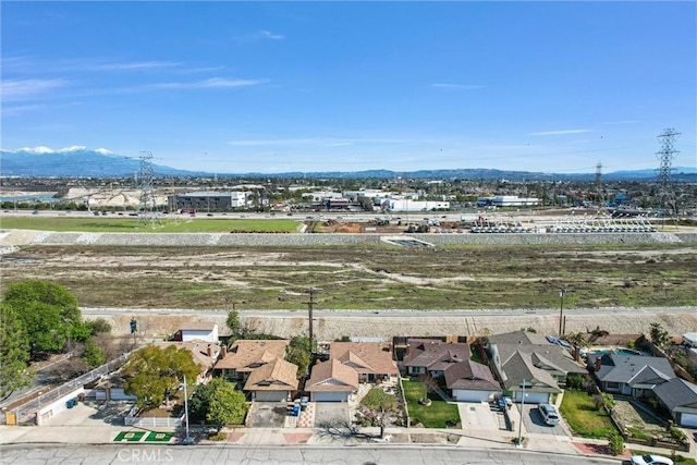 drone / aerial view with a residential view and a mountain view