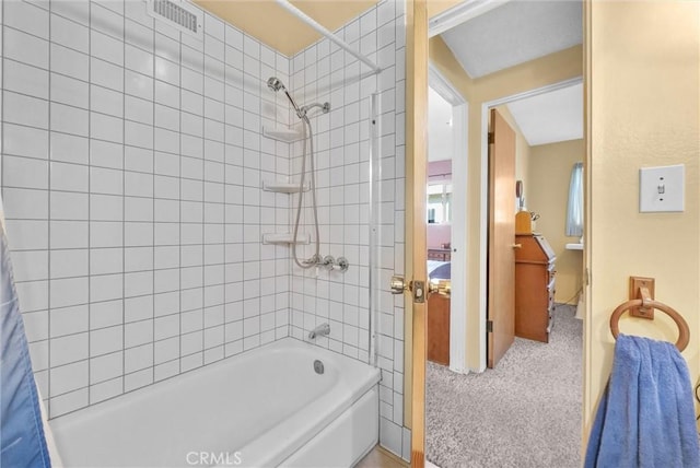 full bathroom with visible vents and shower / bathtub combination with curtain