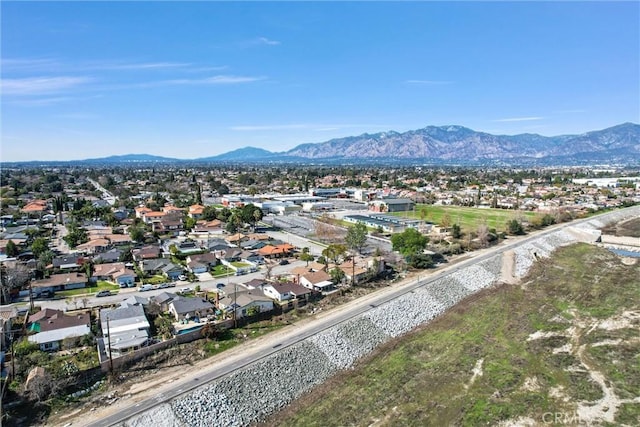 drone / aerial view featuring a residential view and a mountain view