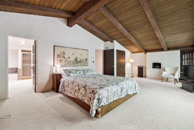 bedroom with lofted ceiling with beams, wooden ceiling, and light colored carpet