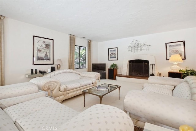 living room with carpet and a fireplace with raised hearth