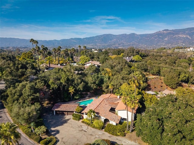 bird's eye view featuring a mountain view and a wooded view