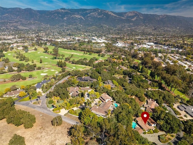 drone / aerial view featuring a mountain view and golf course view