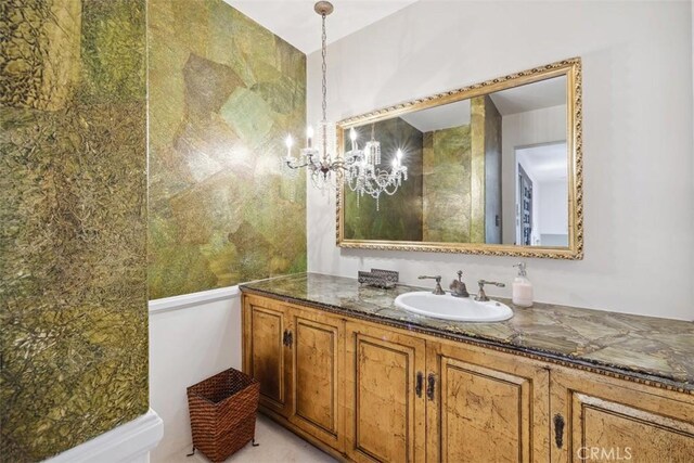 bathroom featuring vanity and an inviting chandelier