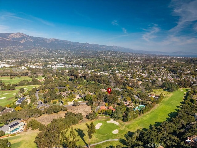 bird's eye view featuring view of golf course and a mountain view