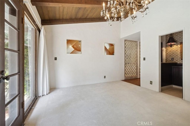 unfurnished room featuring wooden ceiling, carpet flooring, beamed ceiling, and a notable chandelier