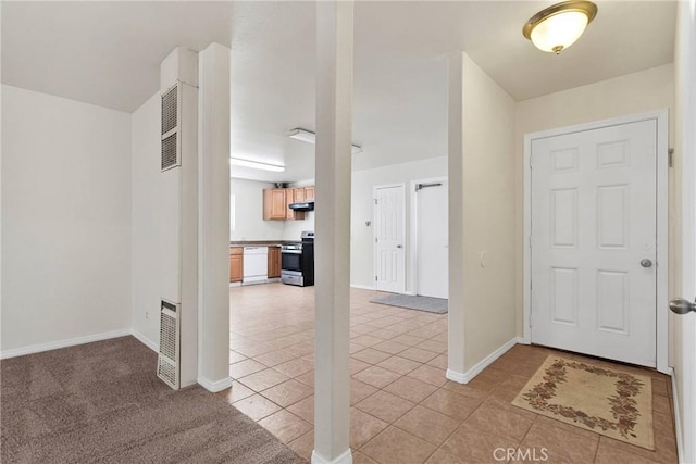 foyer entrance with baseboards and light tile patterned floors