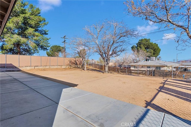 view of yard with a patio and a fenced backyard