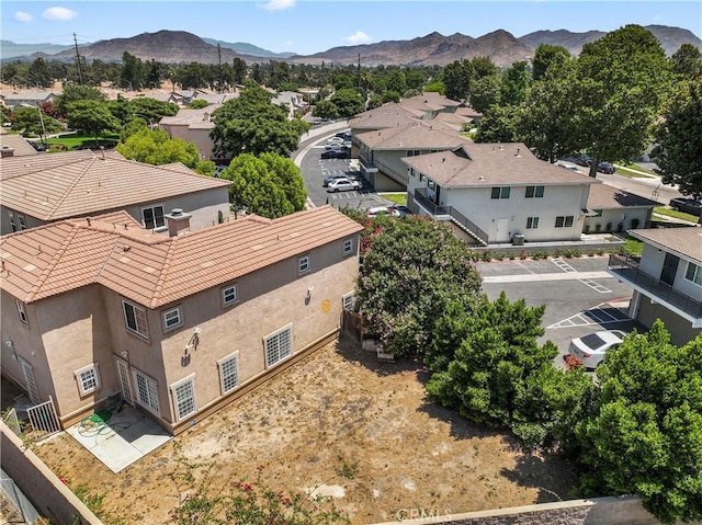 birds eye view of property with a residential view and a mountain view