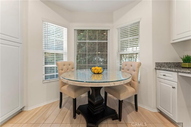 dining area featuring baseboards