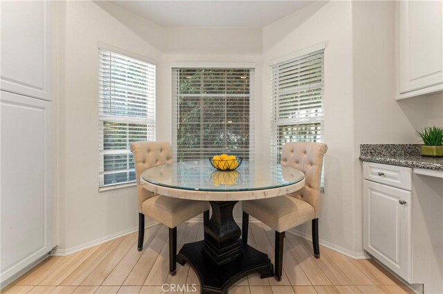 1339 Castledale St, Riverside, CA 92501 - dining room featuring baseboards, light wood-style floors, and breakfast area
