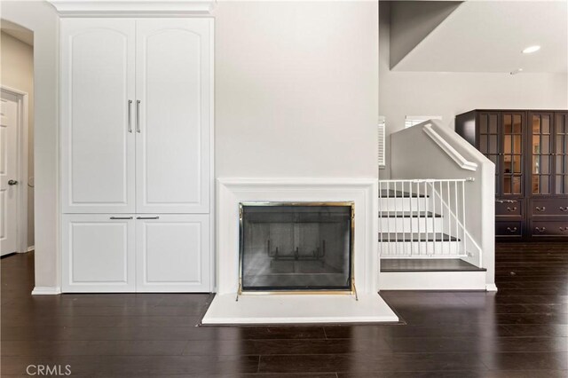 1339 Castledale St, Riverside, CA 92501 - details with baseboards, a glass covered fireplace, and wood finished floors