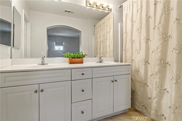 1339 Castledale St, Riverside, CA 92501 - bathroom with double vanity, visible vents, and a sink
