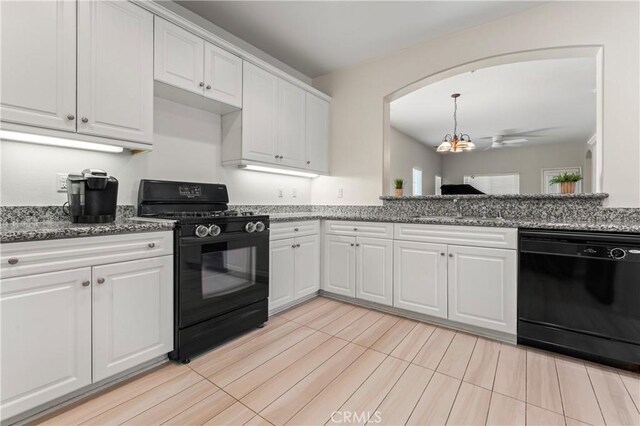1339 Castledale St, Riverside, CA 92501 - kitchen featuring arched walkways, a sink, white cabinets, black appliances, and stone counters