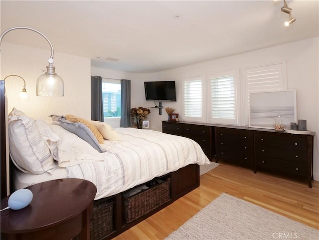 bedroom with light wood-style flooring