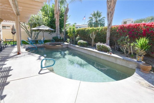 view of swimming pool featuring a patio area, a fenced backyard, and a pool with connected hot tub