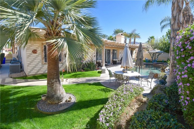 view of yard featuring a fenced in pool and a patio area